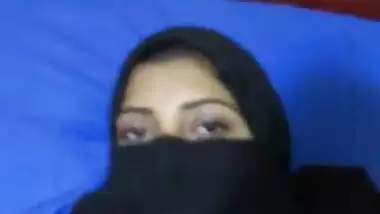 Girl covering face with hizab